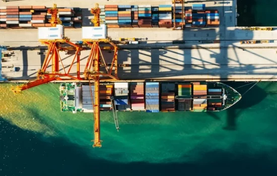 aerial-view-of-containers-loading-and-unloading-to-the-ship-in-the-sea-port-logistic-and-e1665494933937.webp aerial-view-of-containers-loading-and-unloading-to-the-ship-in-the-sea-port-logistic-and-e1665494933937.webp